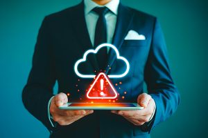 Cloud security alert with warning icon on smartphone, cybersecurity risk, technology safety, data protection.